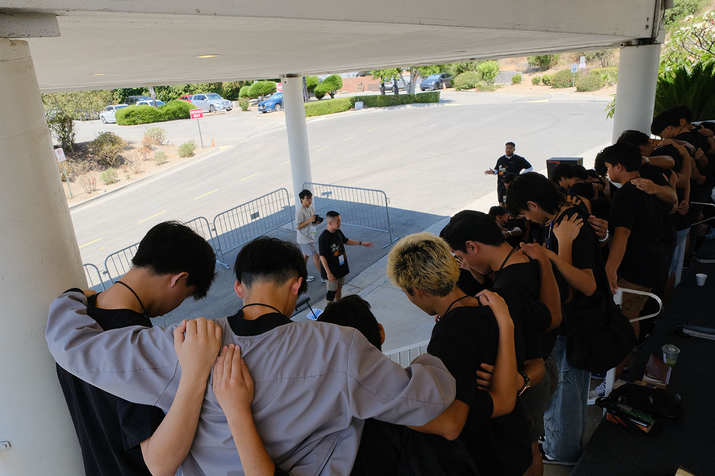 Group of teens huddled in prayer