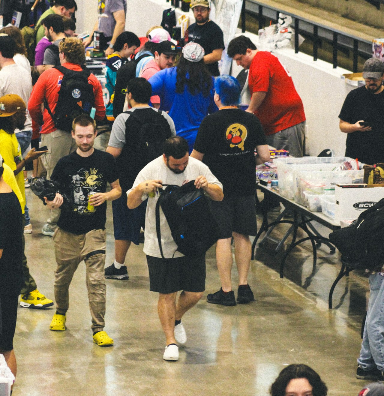 A crowd of attendees moving through a convention centre on show day