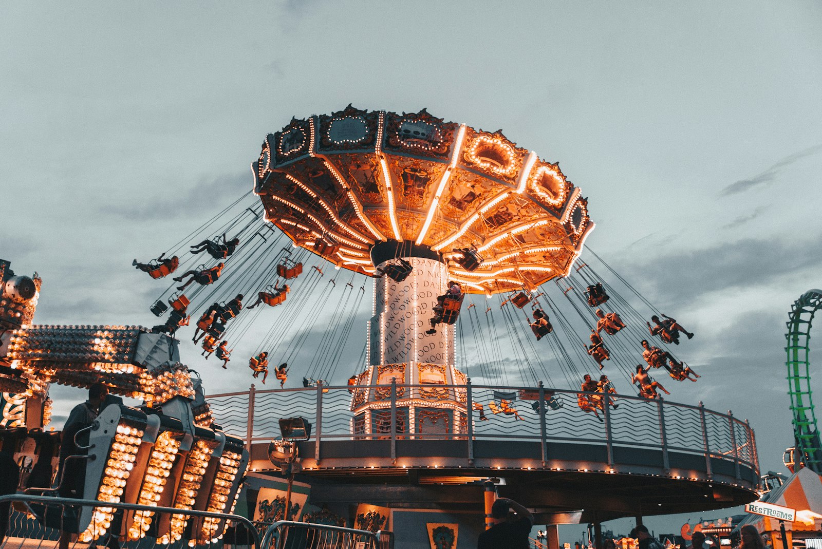 Carnival swing ride lit up at dusk