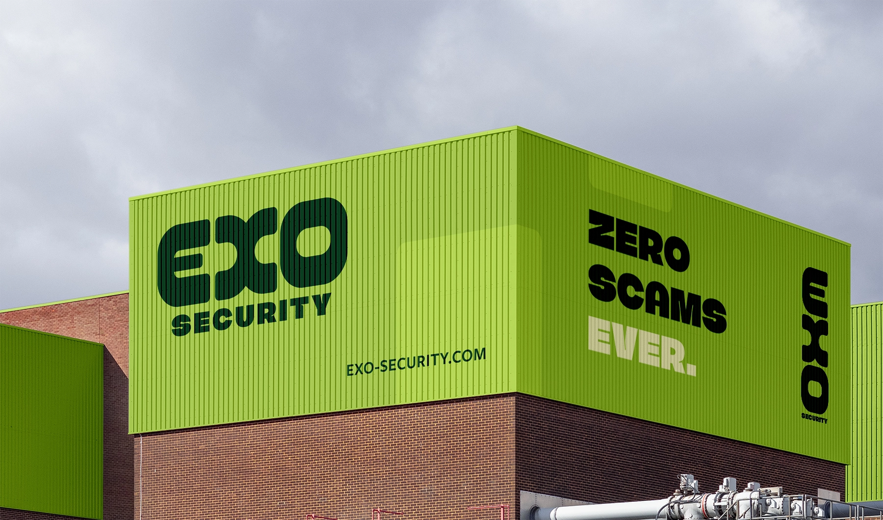 A storage container building with eh Exo branding on it. Green signage with "Zero Scams Ever" as the tagline.