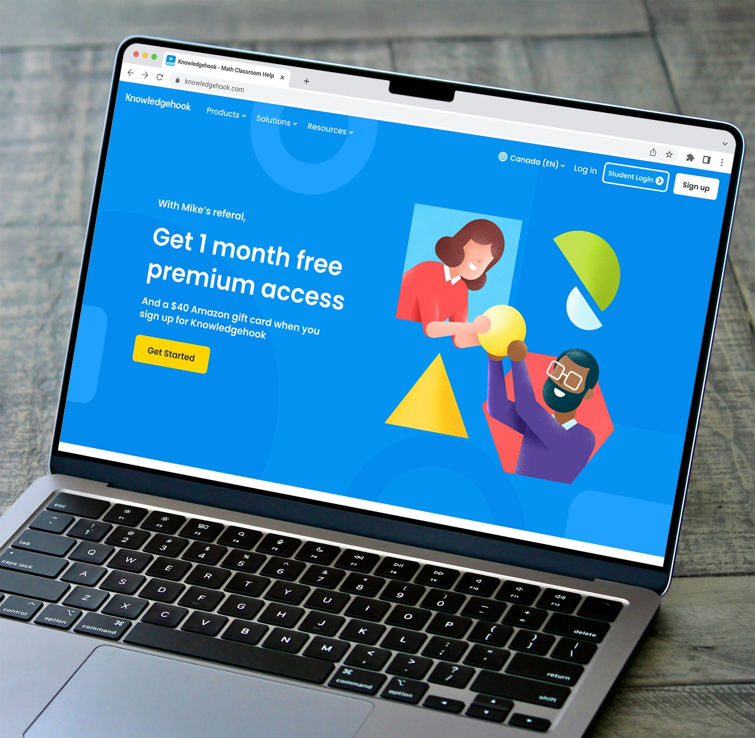 Laptop is open to a referral page on the Knowledgehook website.