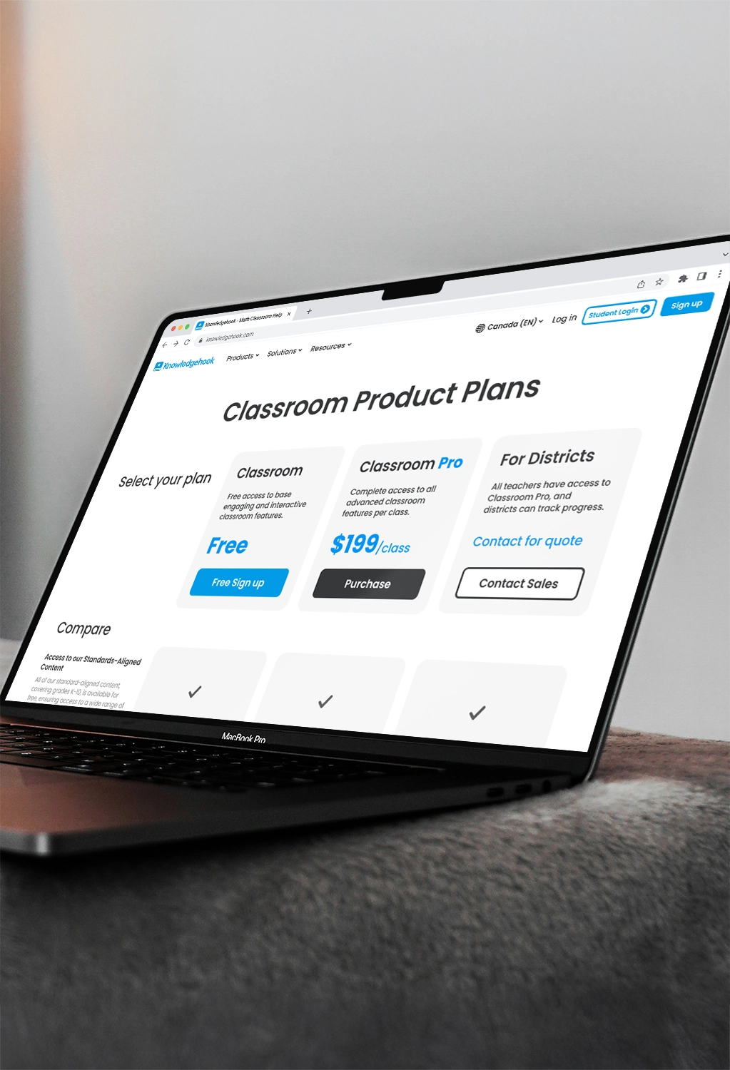 Open laptop on table. Pricing page is open