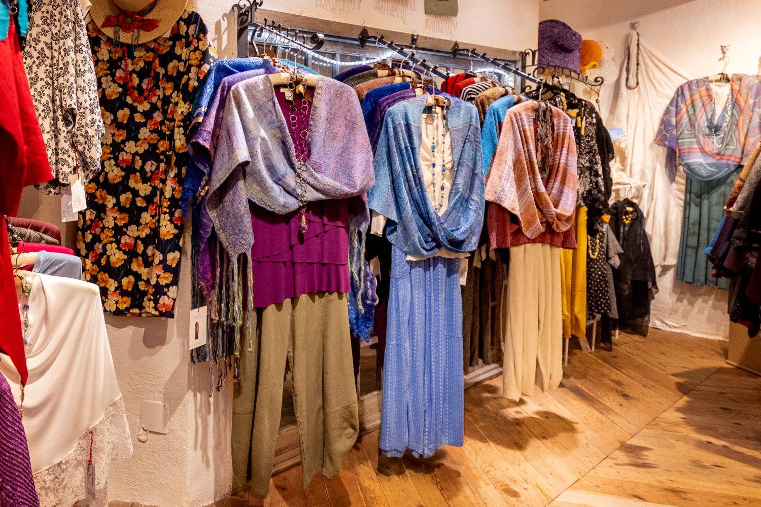 Clothing items hanging in Handwoven Originals shop at Loretto