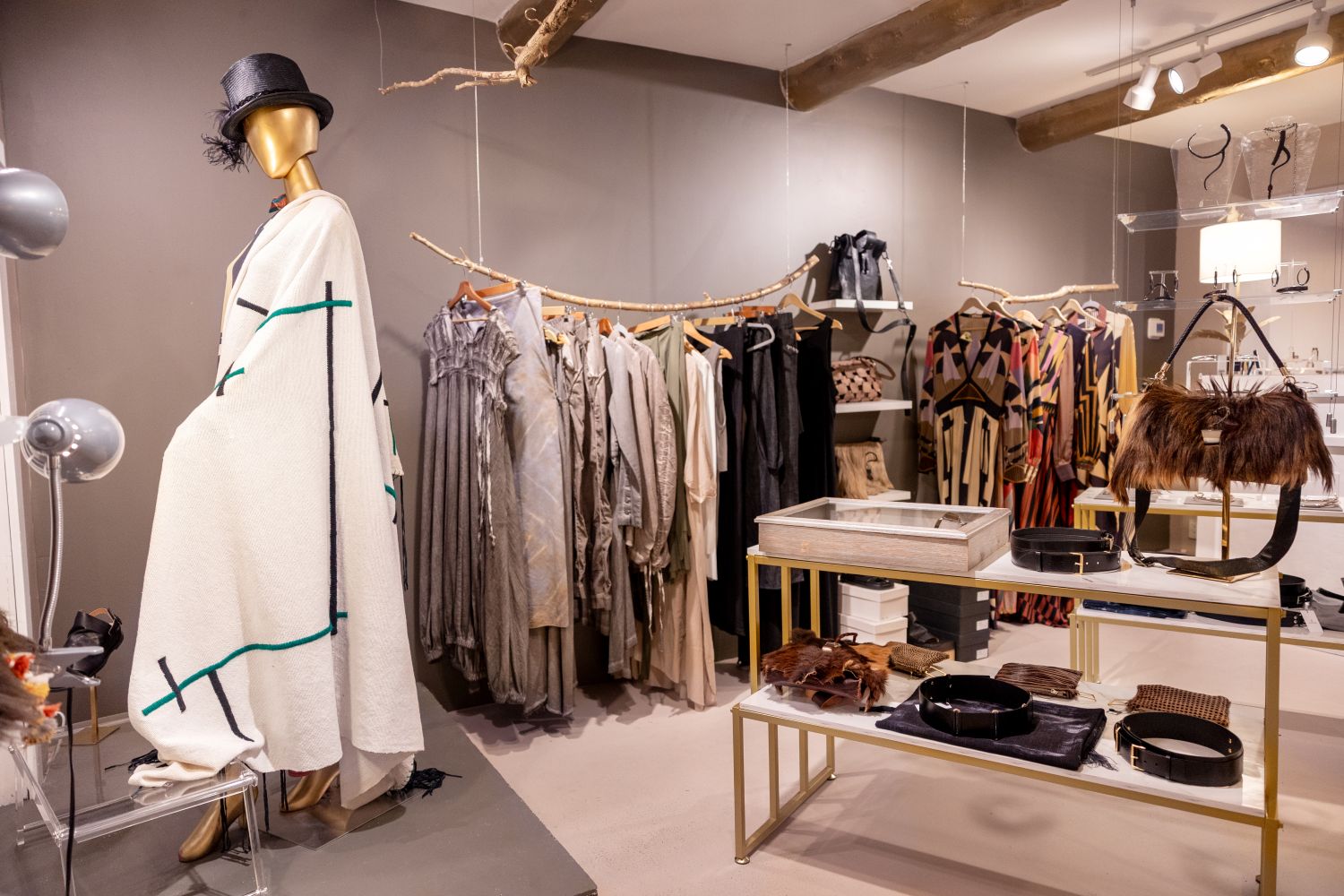 Tribu shop with clothing, handbags, belts on display