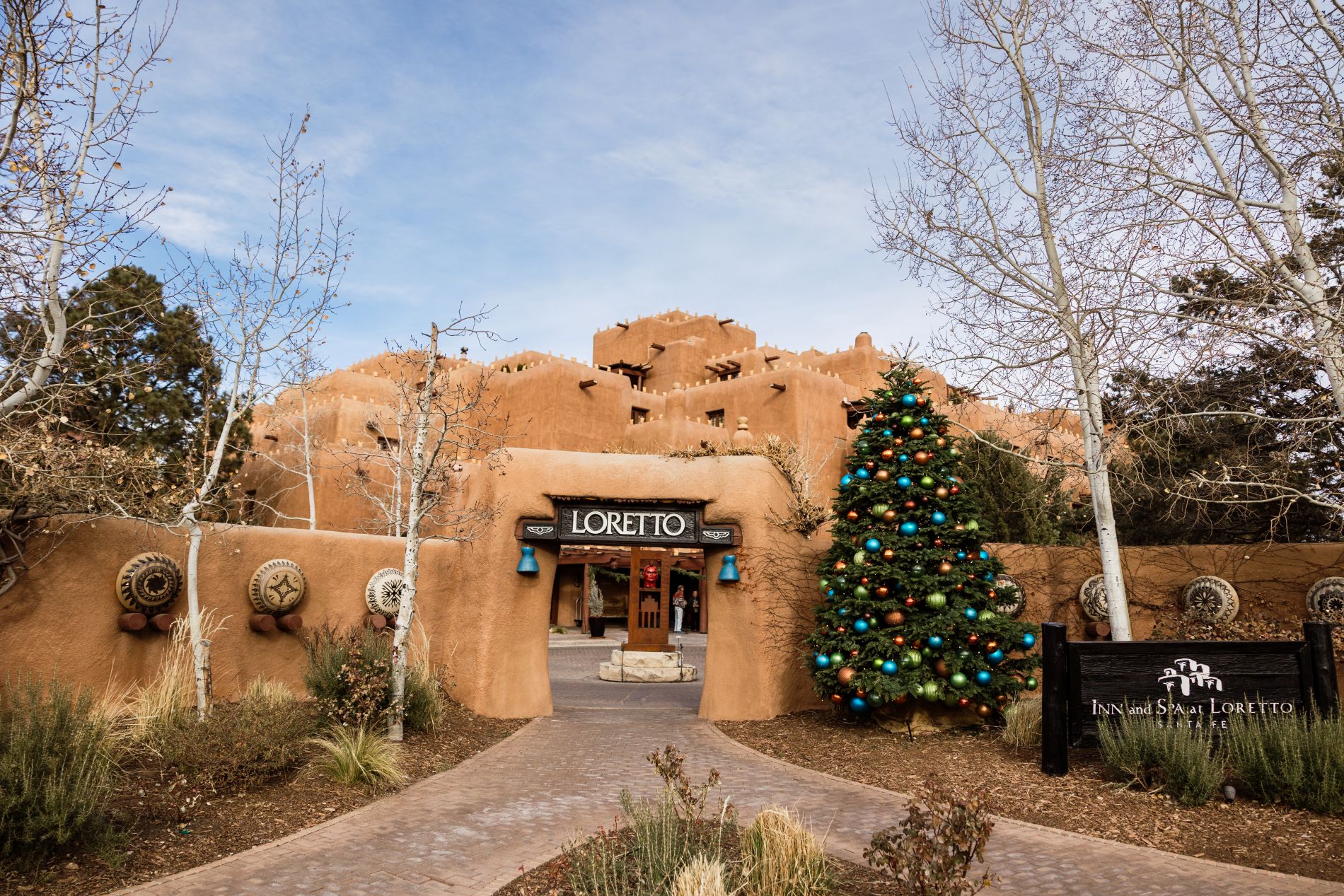 Exterior of Inn and Spa at Loretto in winter with a decorated tree