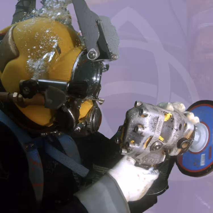 Commercial diver in full diving gear working underwater, used to illustrate TAC Healthcare’s Offshore Medic Diving Awareness course.