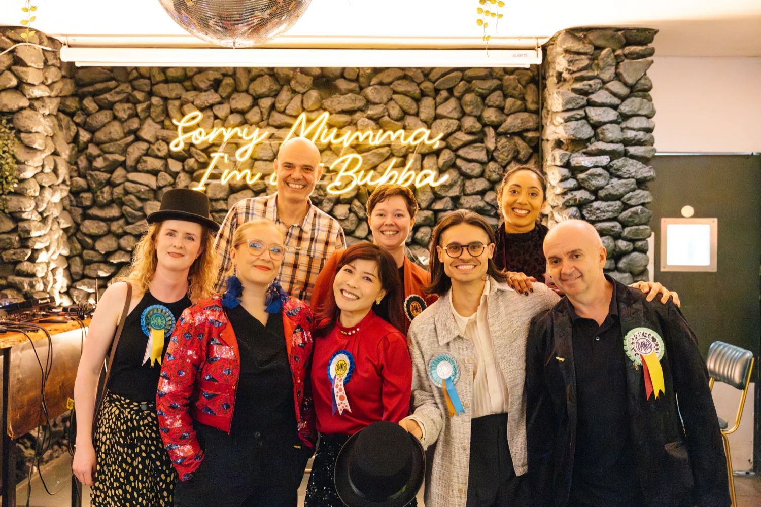 The Abracademy team wearing their Dang badges