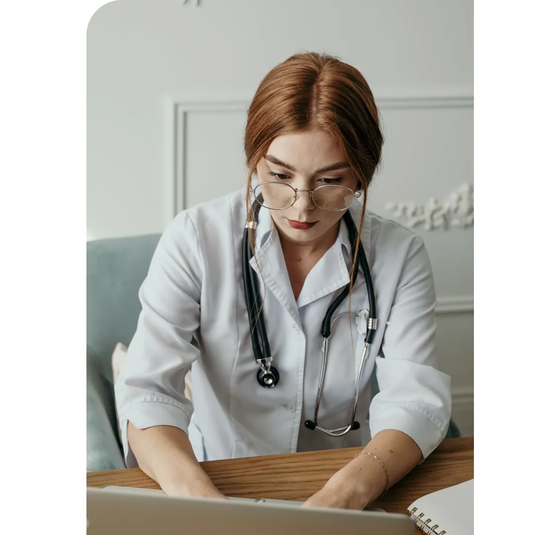 Image of a woman doctor on a computer