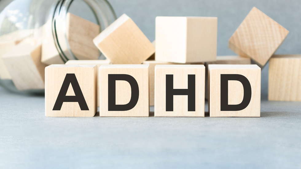 Wooden blocks with letters on them spelling "ADHD".