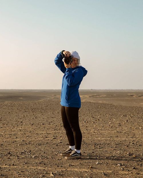 Marie-Christine Huot taking a photo in the Paracas desert