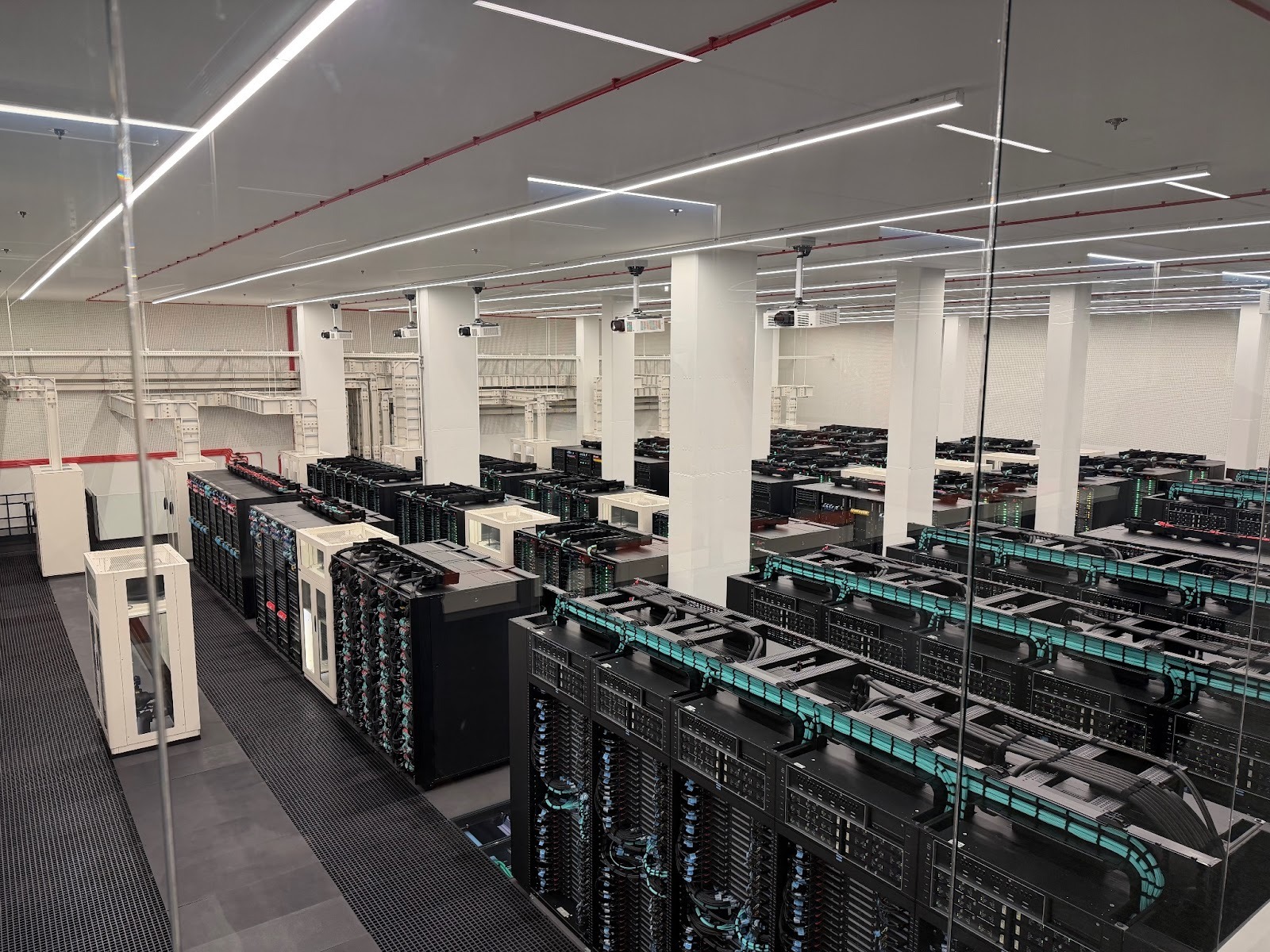 A photo of the server racks of Marenostrum 5, a pre-exascale EuroHPC supercomputer hosted at BSC where the ALIA models have been trained