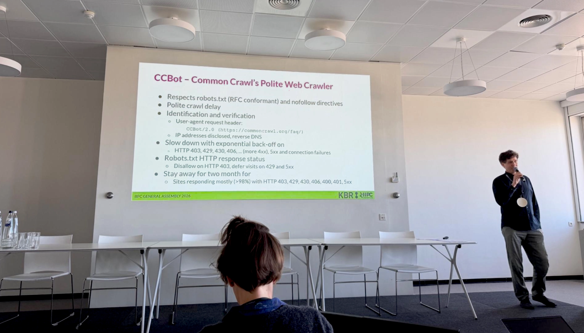 A photograph of Sebastian Nagel giving a presentation on CCBot