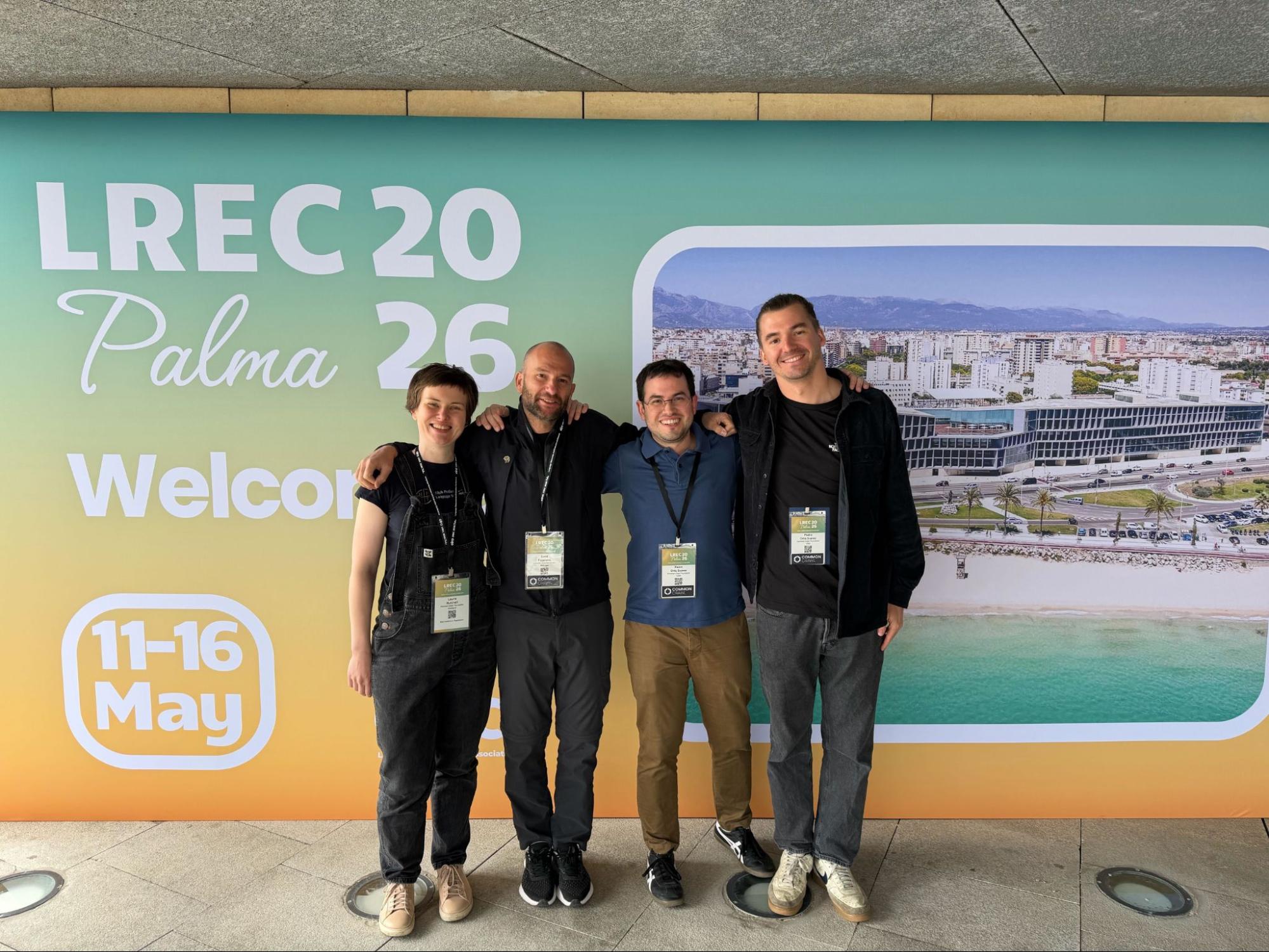 A photo of Laurie Burchell, Luca Foppiano, Pedro Ortiz Suarez, and Malte Ostendorff at LREC 2026 in Palma, Mallorca.