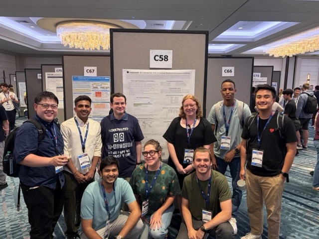A photo of some of the CommonLID co-authors at the ACL poster session