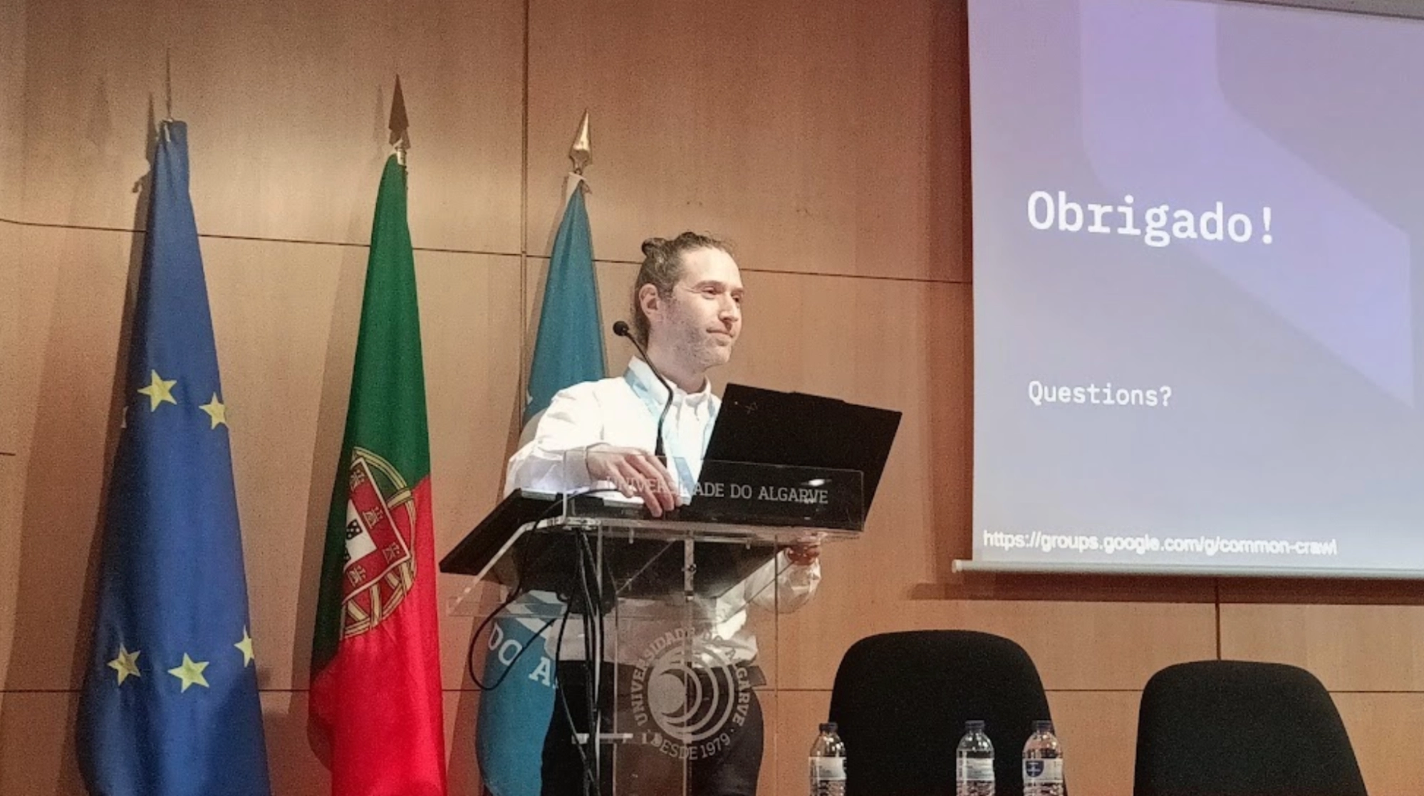 A photo of Michael Paris presenting the long paper "Measuring What the Crawler Sees: Discovery Curves, Core Persistence, and Shell Dynamics in Longitudinal Web Crawls"