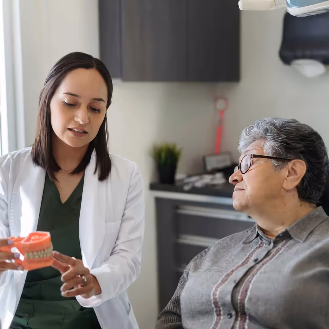 Female patient getting dentures for the denturist
