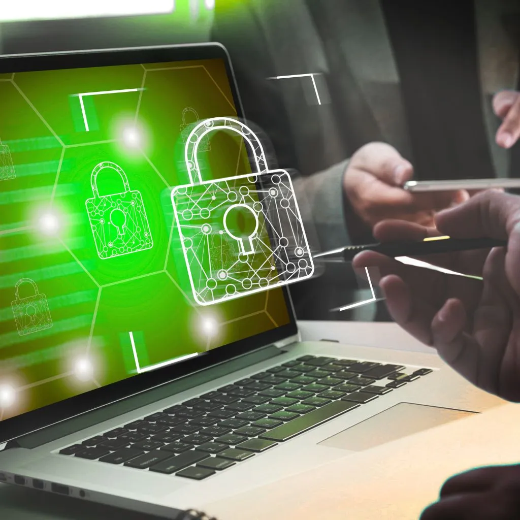 A person using a laptop with a padlock on the screen.