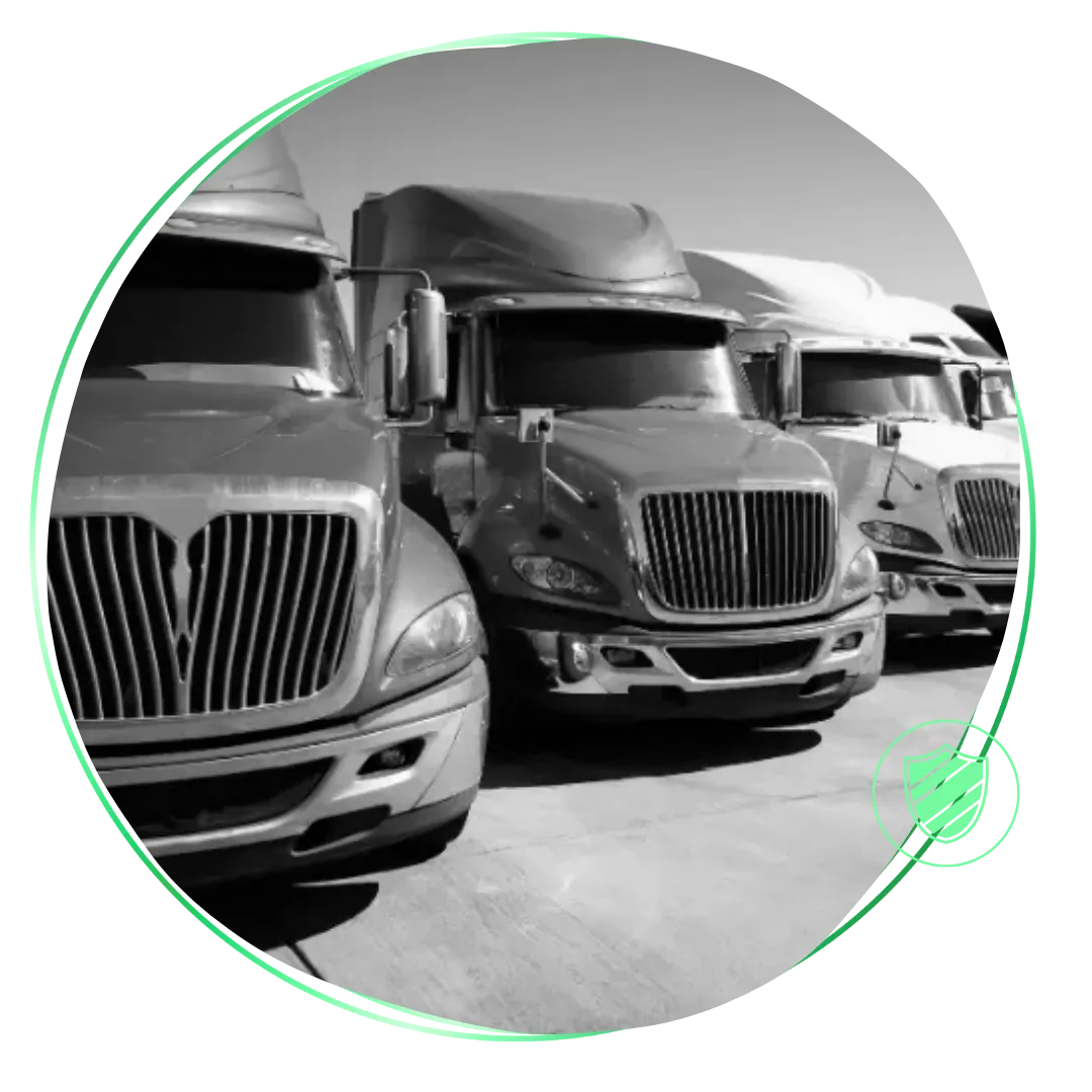 A black and white photo of semi trucks.