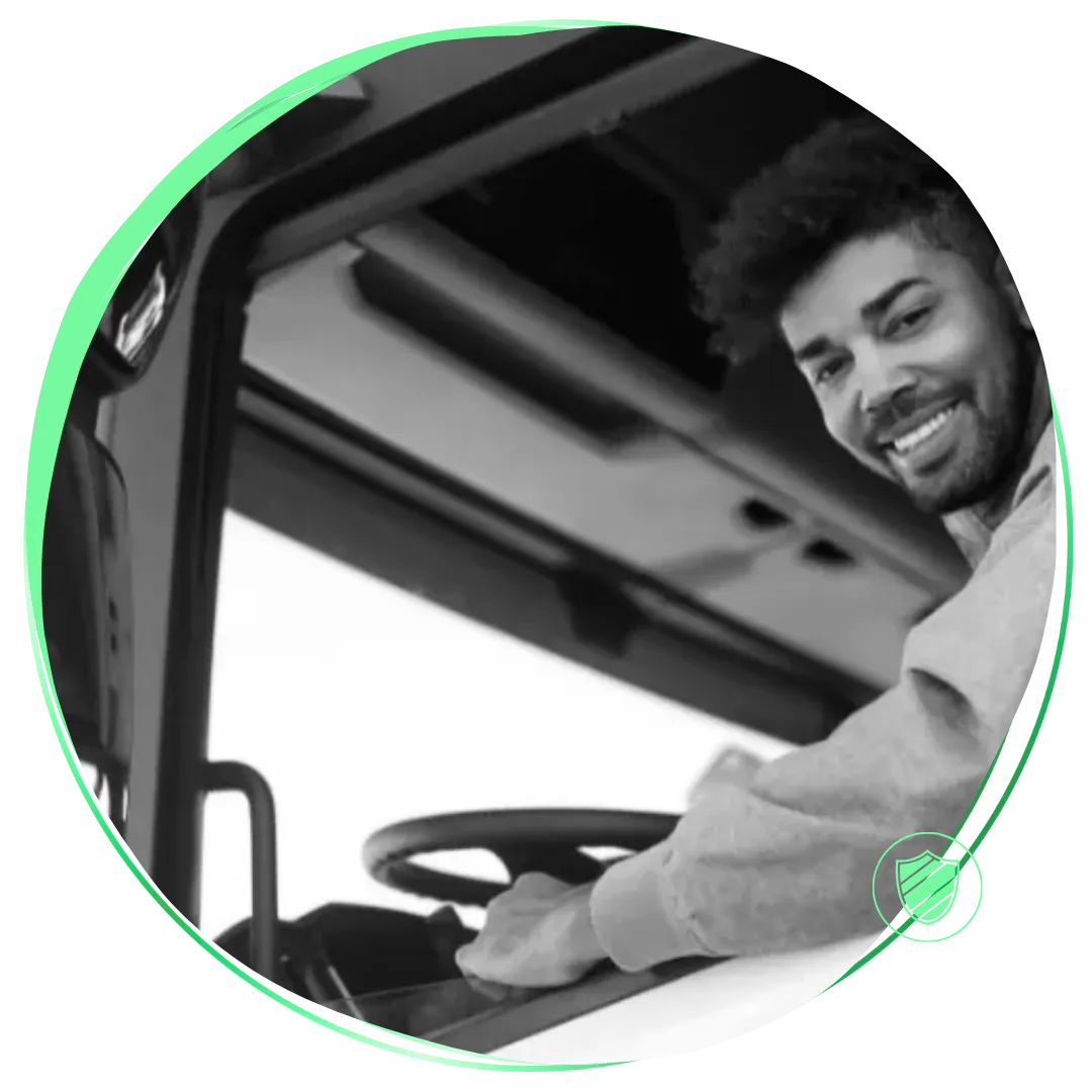 A man driving a bus with a green circle around him.