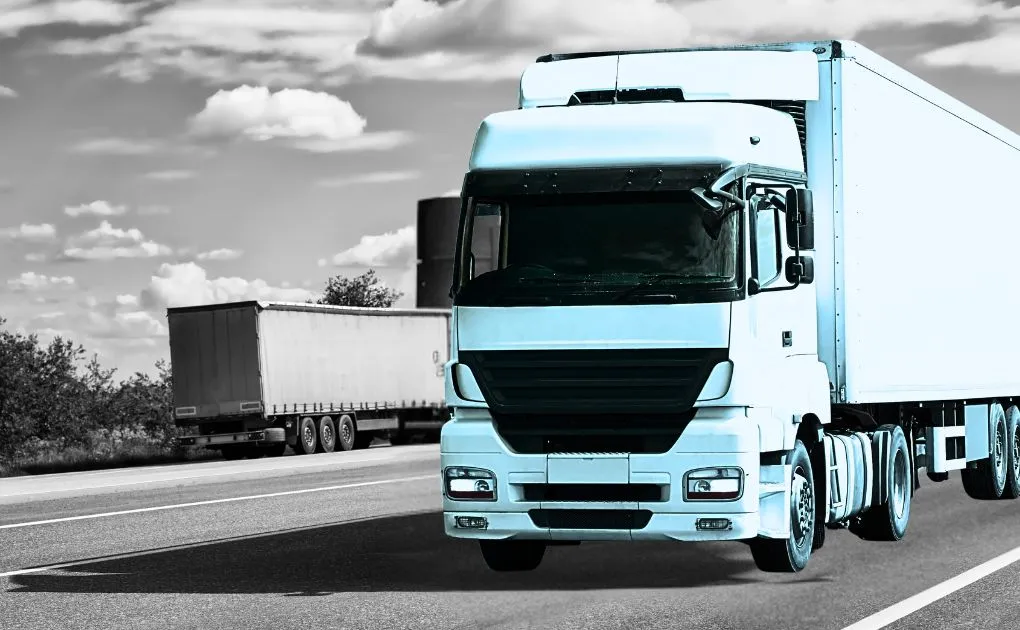 A black and white photo of a semi truck.