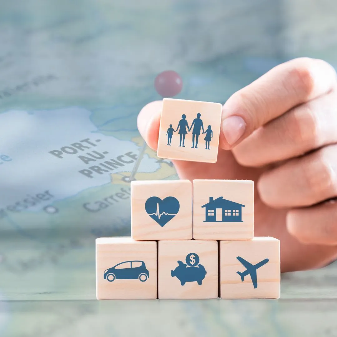 A person holding a wooden block with a map in the background.