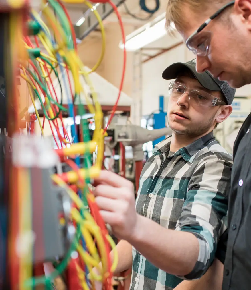 two men working on circuits