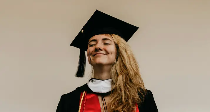 woman happy in graduation cap
