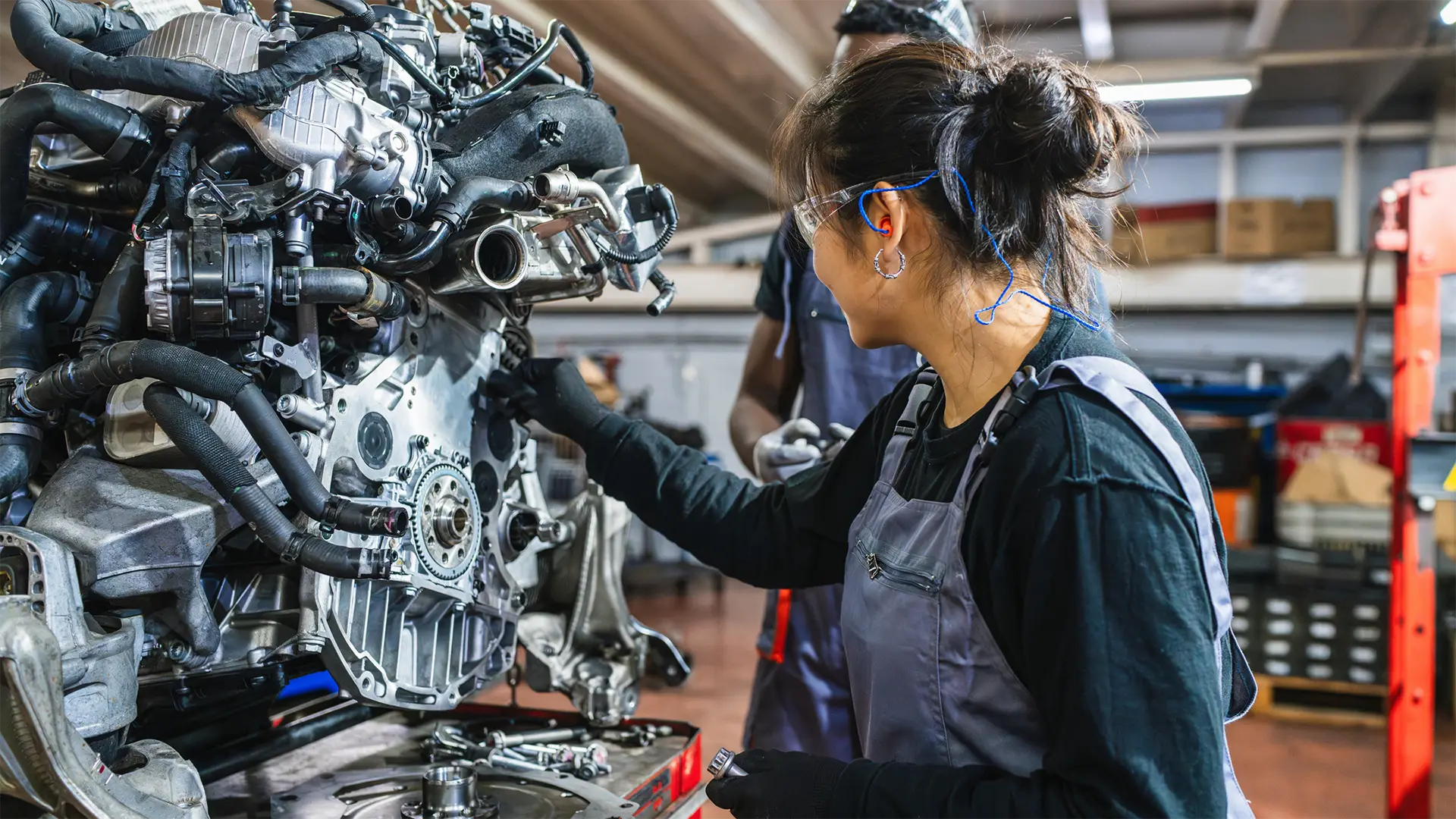 woman working on motor