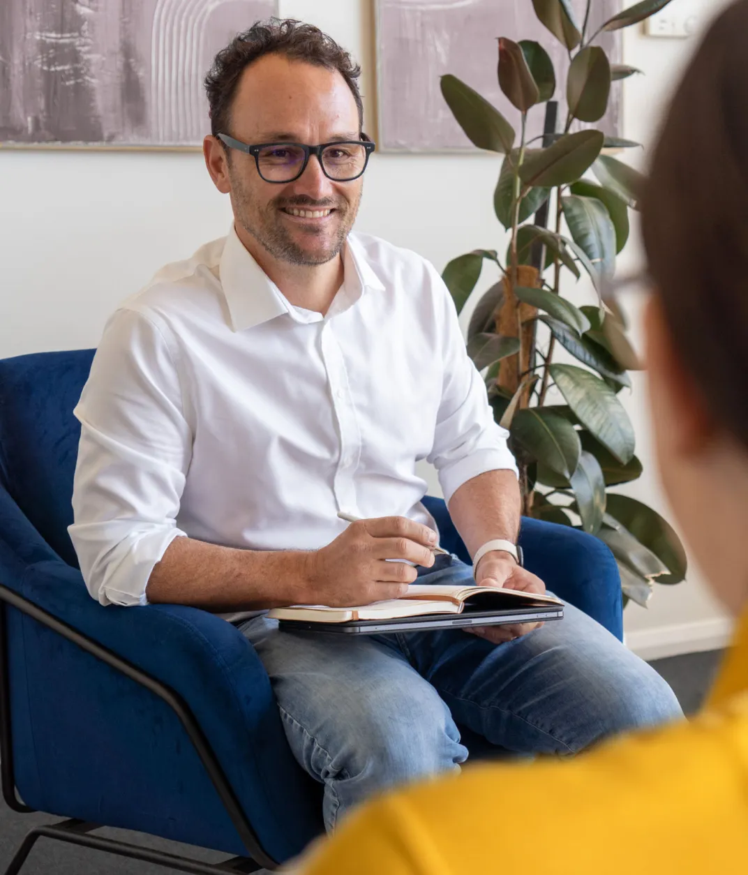 Rhys Lyster happily listening to a client