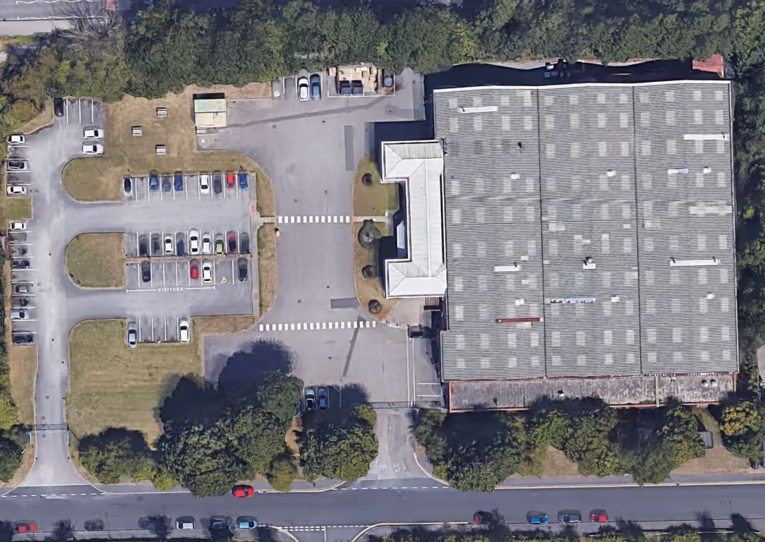 Google Maps satellite image of a factory, offices and car park