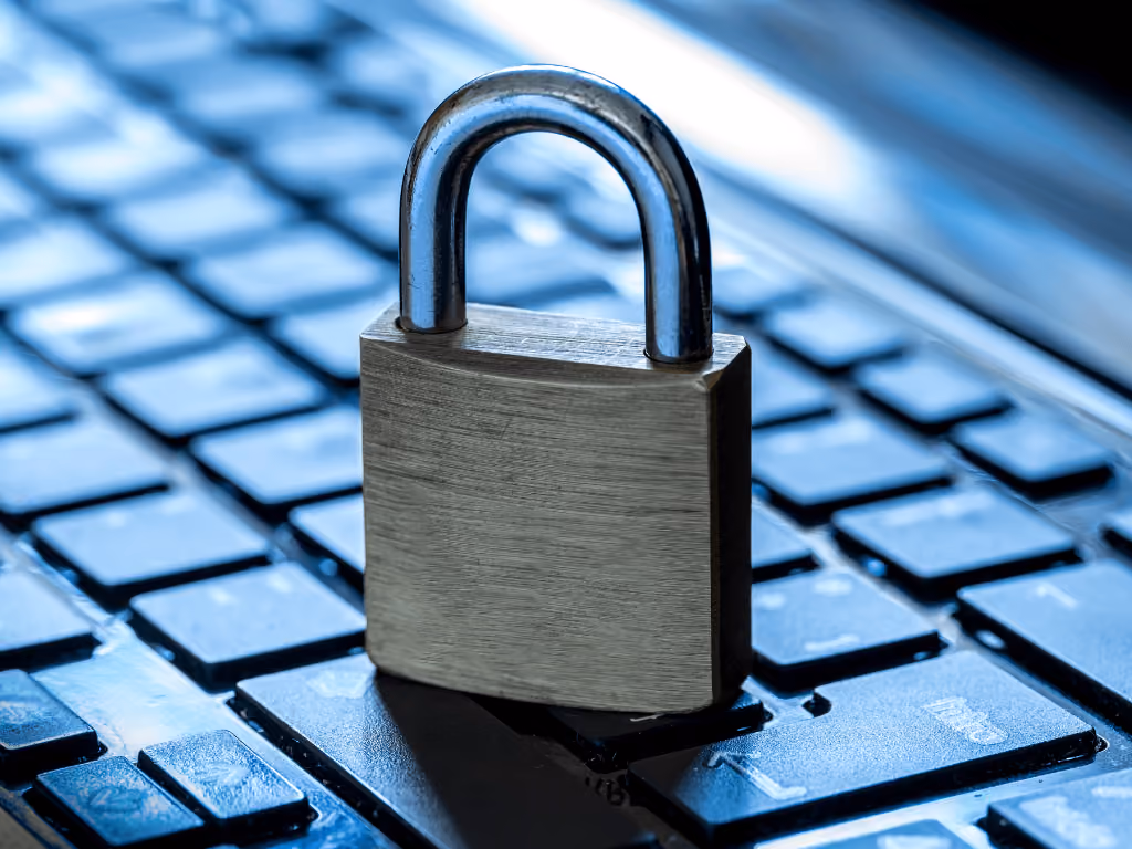 A padlock on top of a laptop keyboard