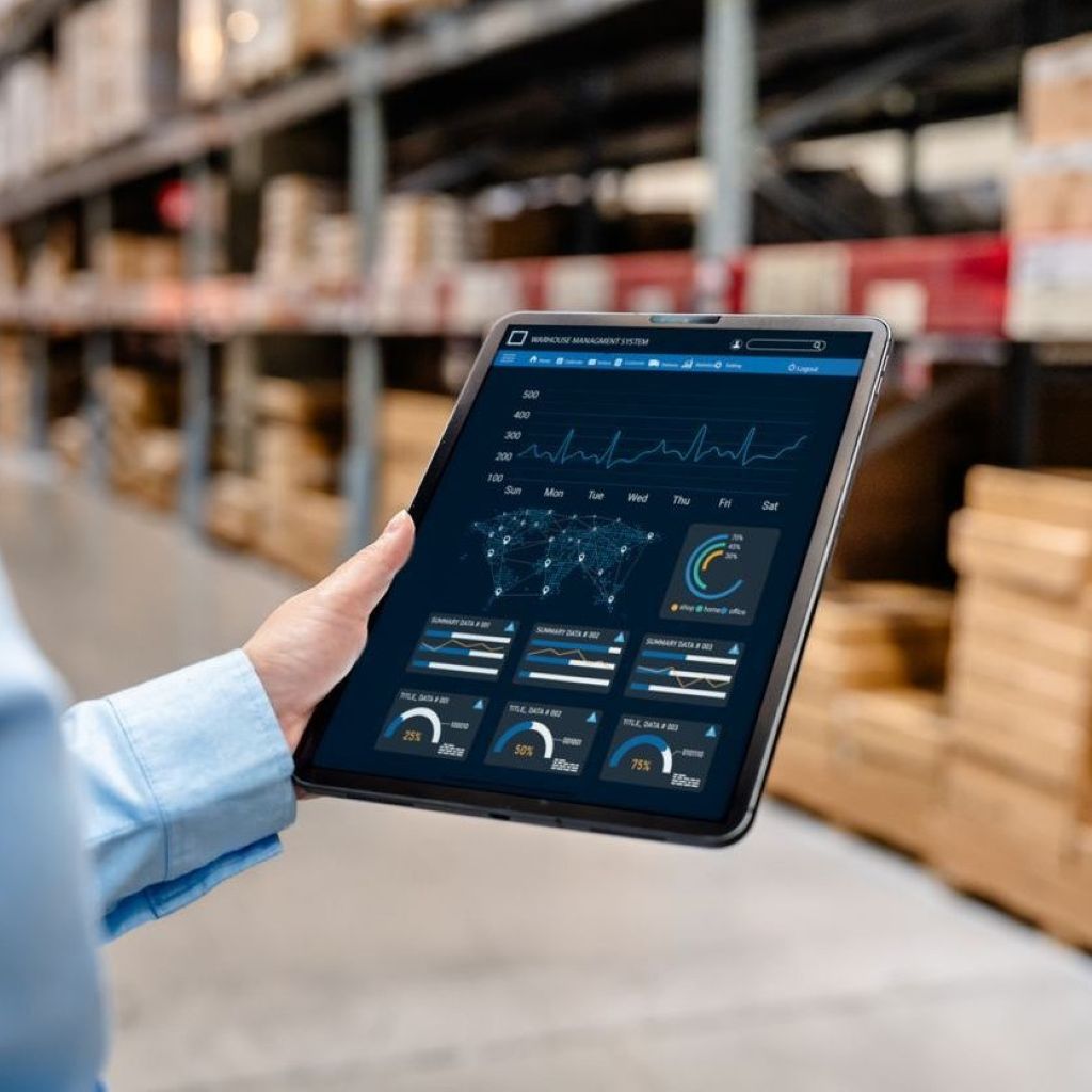 Warehouse perative using a tablet device wirelessly to access a warehouse management system