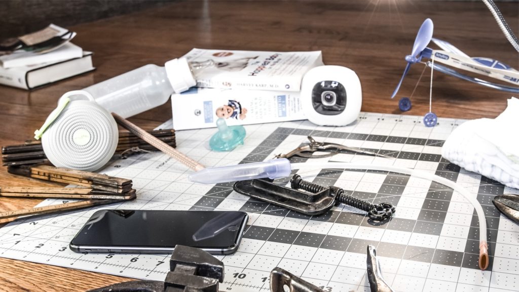Various gifts and gadgets for dads strewn across the floor