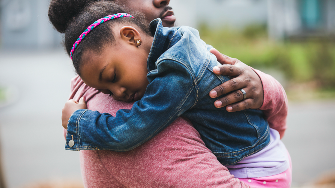 Father hugging his daughter.