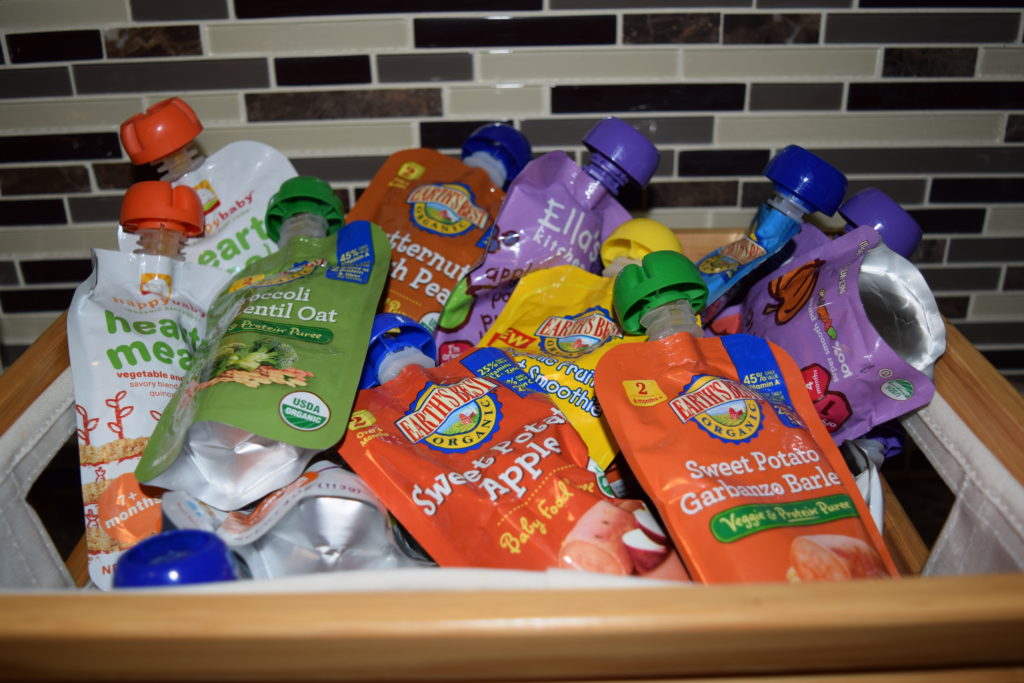 A collection of baby toddler yoghurt or puree-like snacks