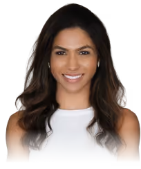 Smiling woman with long wavy dark hair wearing a sleeveless white top.