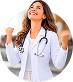 Smiling female doctor with stethoscope celebrates with clenched fists.