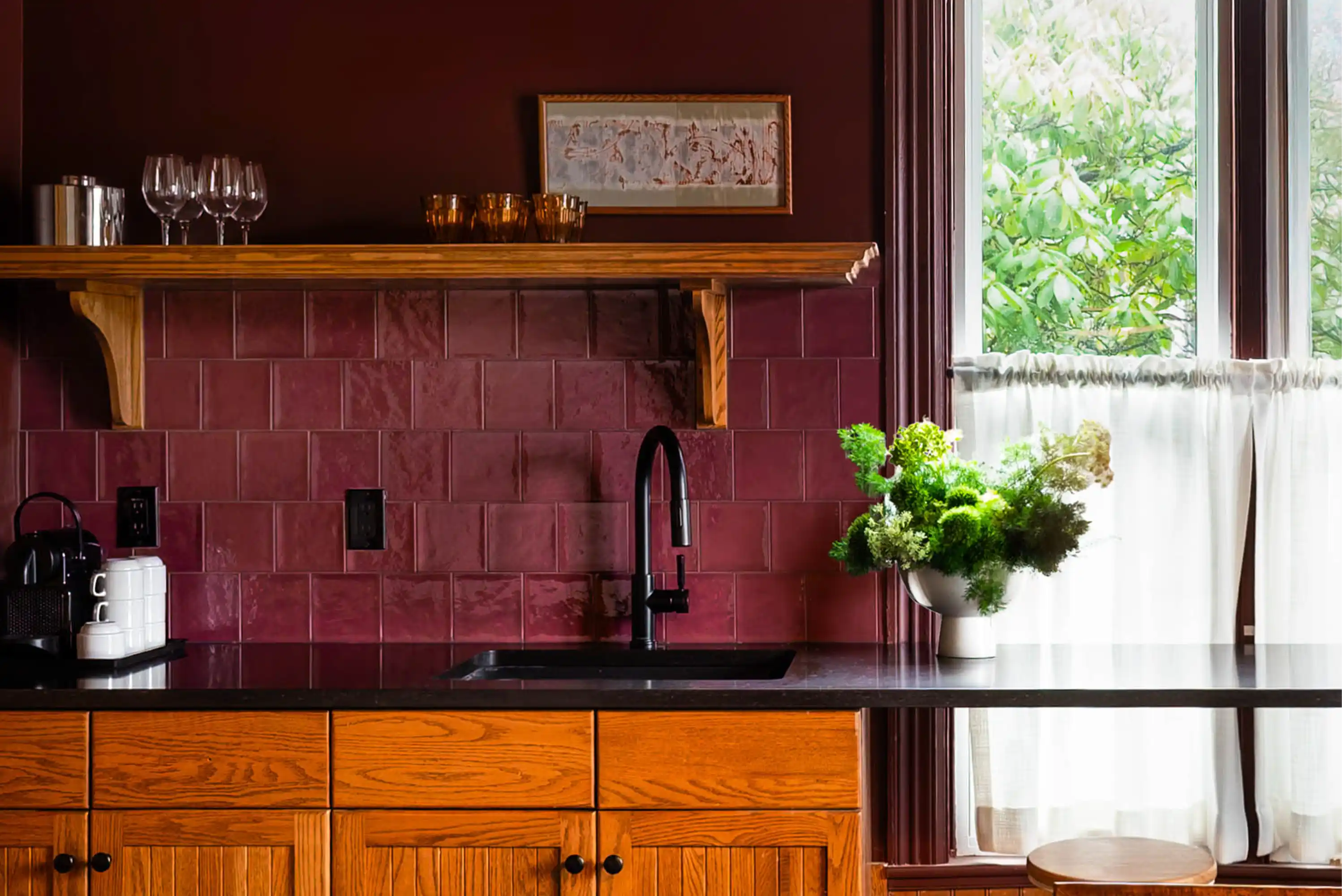 Interior design renovated kitchen with a plum coloured wall and backsplash.