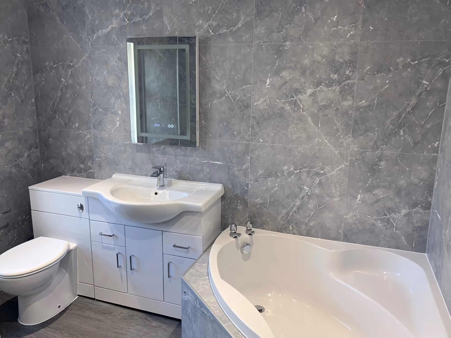 Bathroom with corner bath