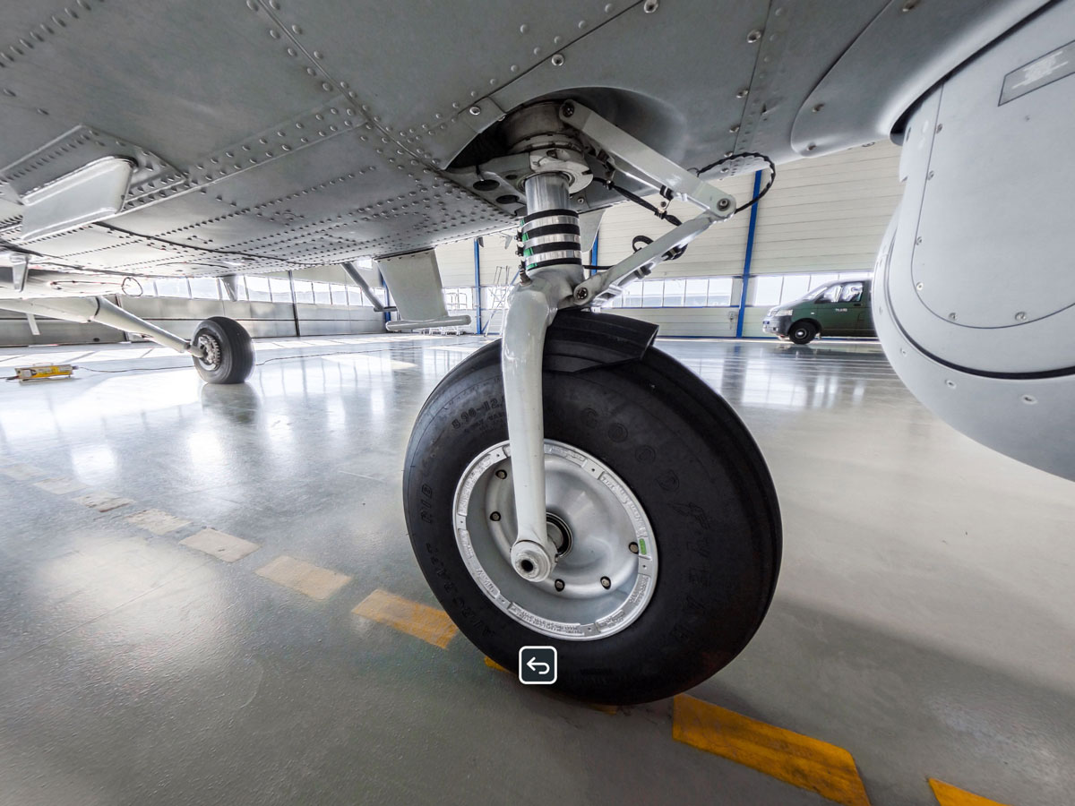 A Twin Otter nose wheel inspection step in the trainer, with a tap-to-identify task