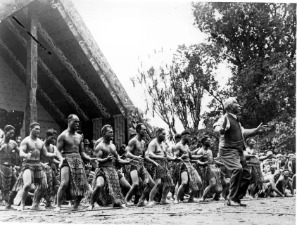 A picture of the haka being performed for the opening of Te Whare Runanga
