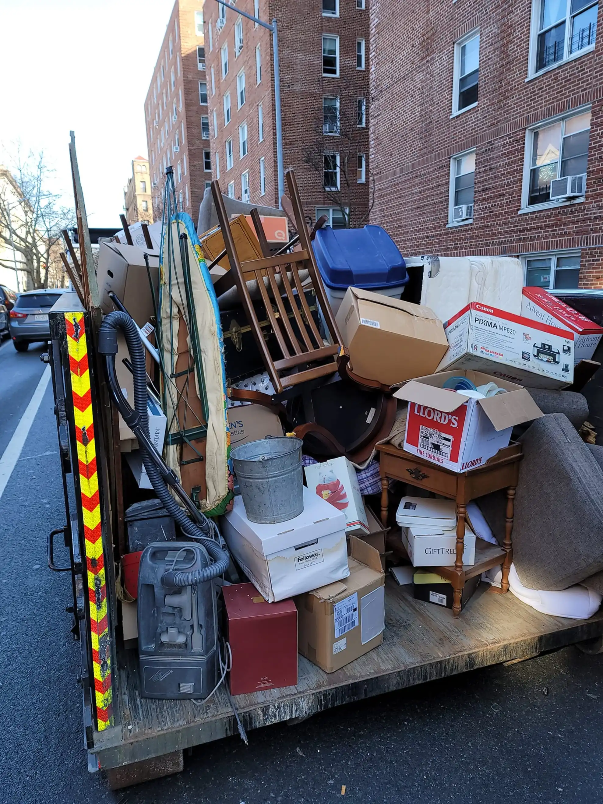 strictly junk removal removing large amount of junk in a residential Brooklyn neighborhood