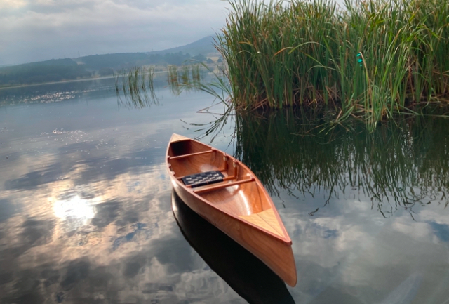 Timber boats, canoes and paddles.