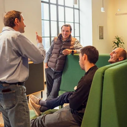 Group of Proof employees talking