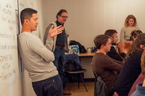 A Proof employees talking to a group