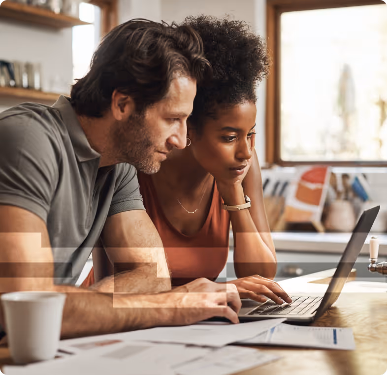 woman and man looking at laptop.
