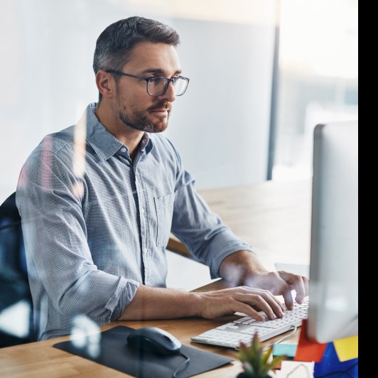 An enterprise team member working at a desktop