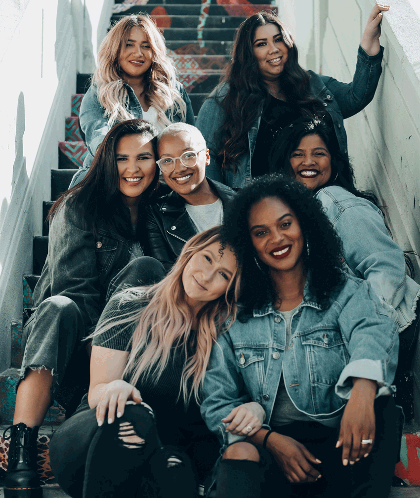 Multicultural group of women smiling at camera