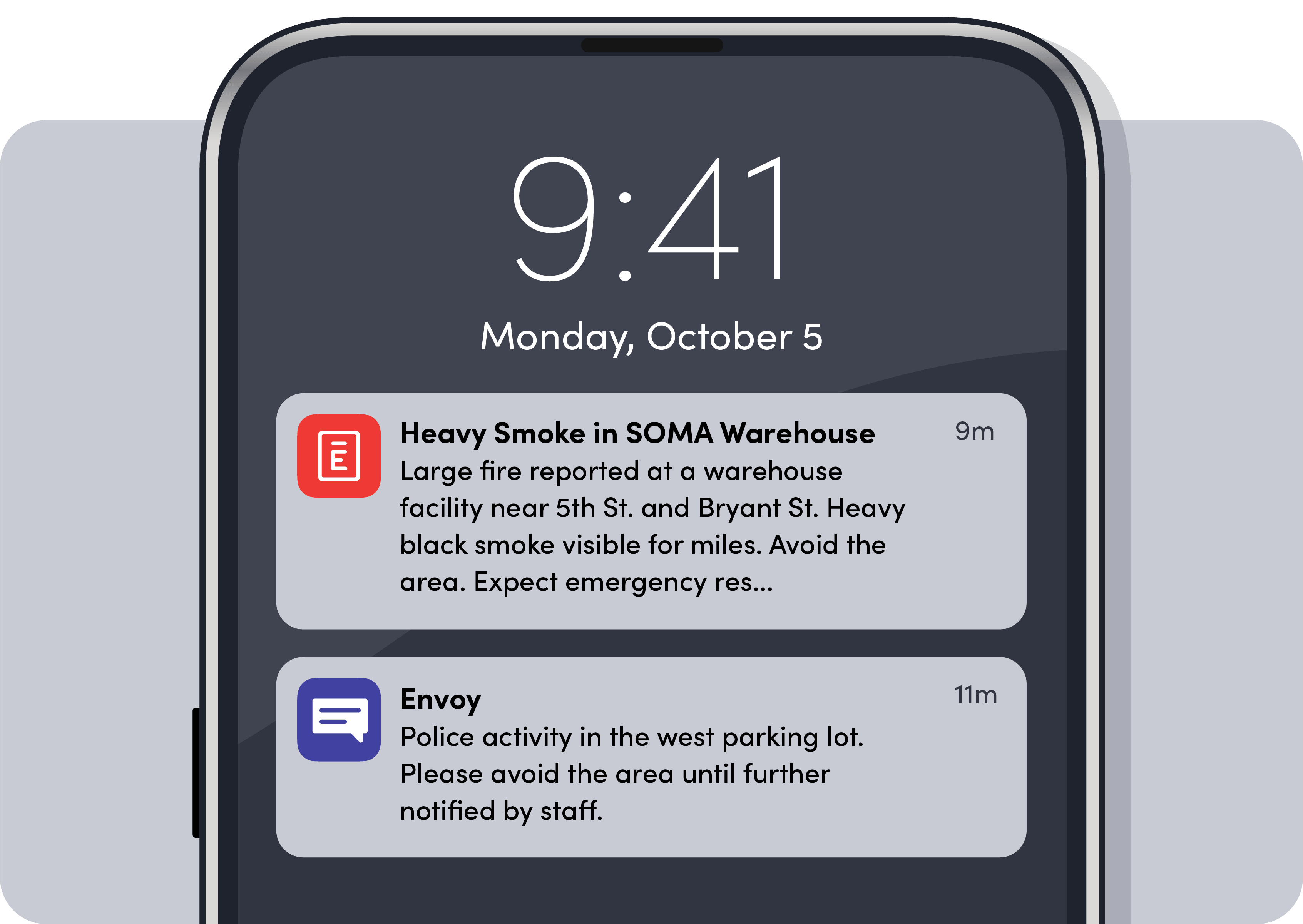 Phone screen showing two alerts: heavy smoke fire in SOMA warehouse and police activity in west parking lot.