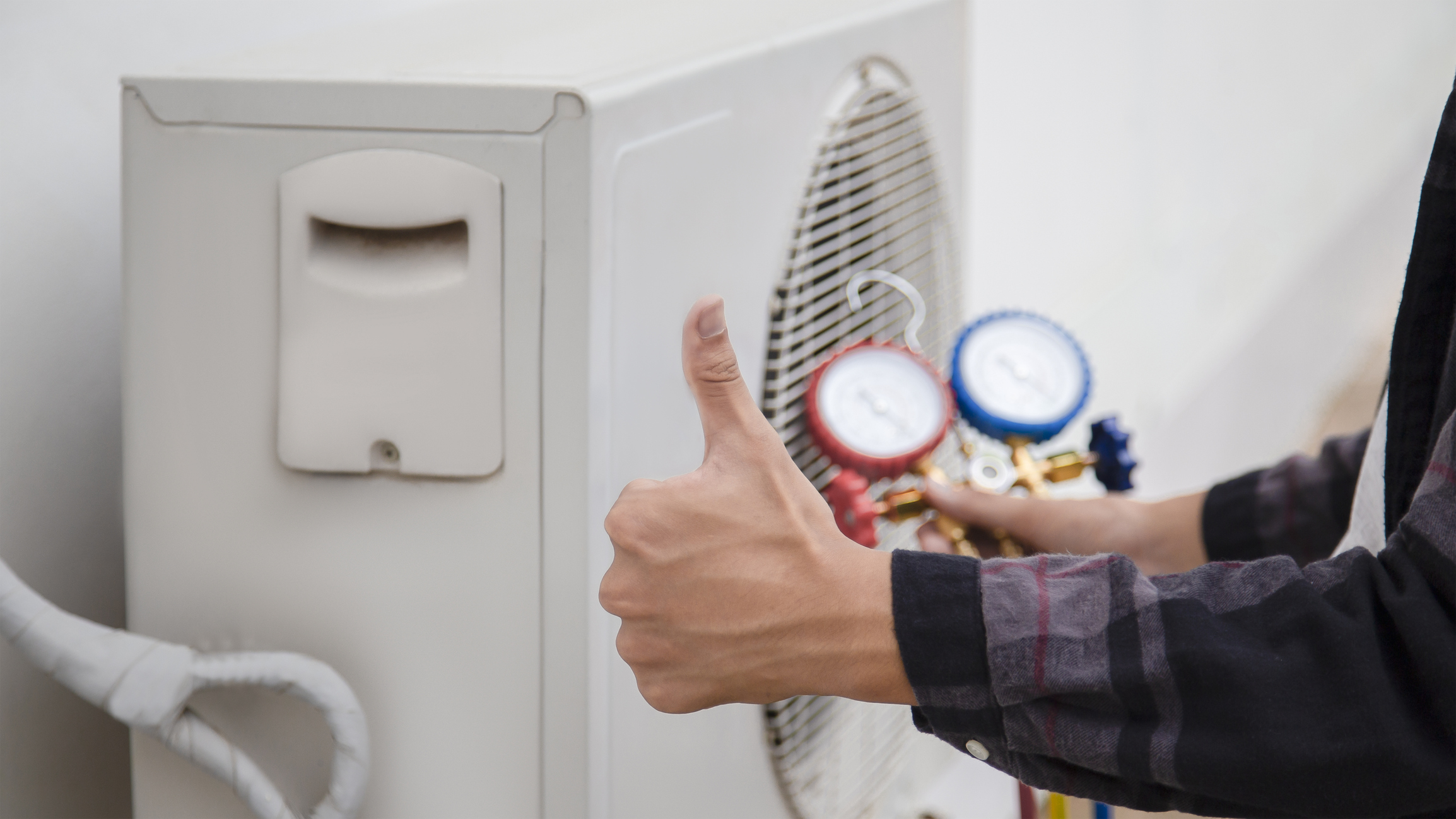 HVAC technician showing a thumbs up